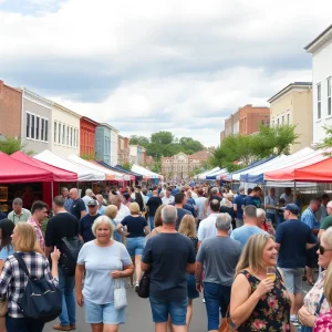 People enjoying the Sip & Stroll event in Historic Laurens Square