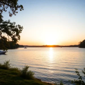 Calm waters of Lake Greenwood at sunrise with boats