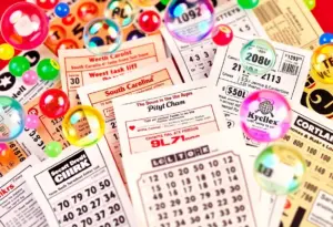 Various South Carolina Lottery tickets including Powerball and Mega Millions with celebratory decorations.