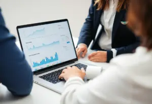 Digital marketing team reviewing social media metrics analysis on a laptop.