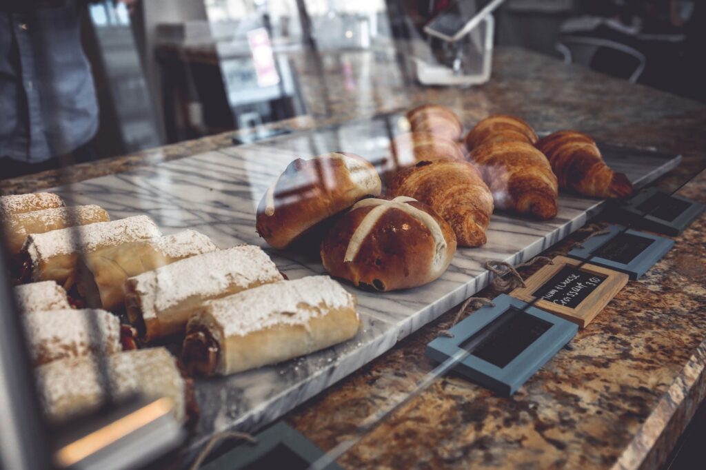 Croissants and pastries in a bakery display case