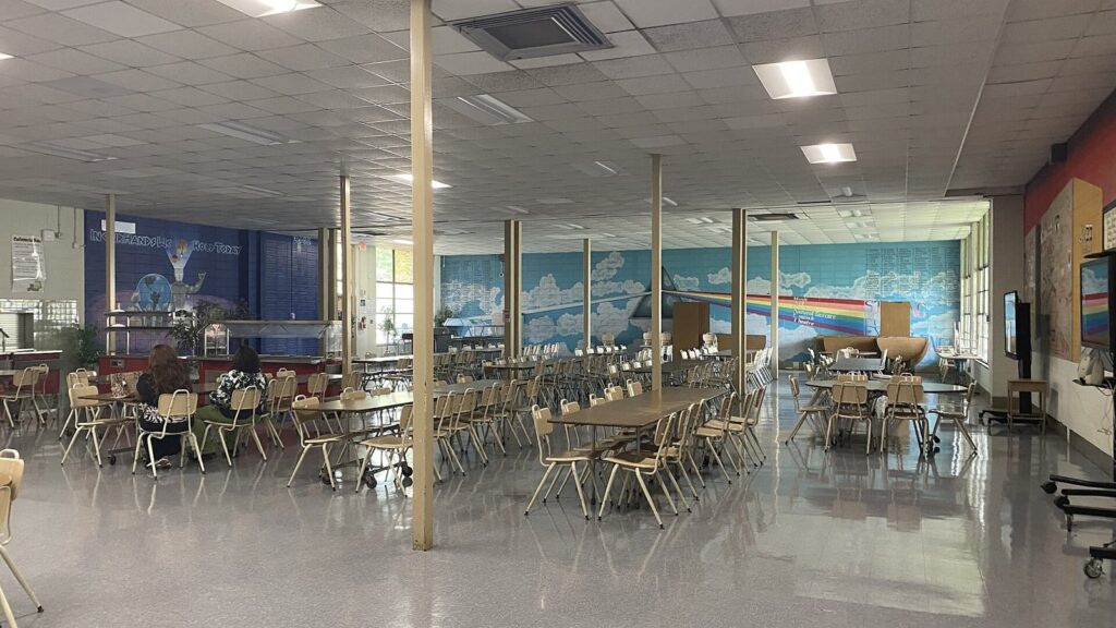 School cafeteria with tables and serving line